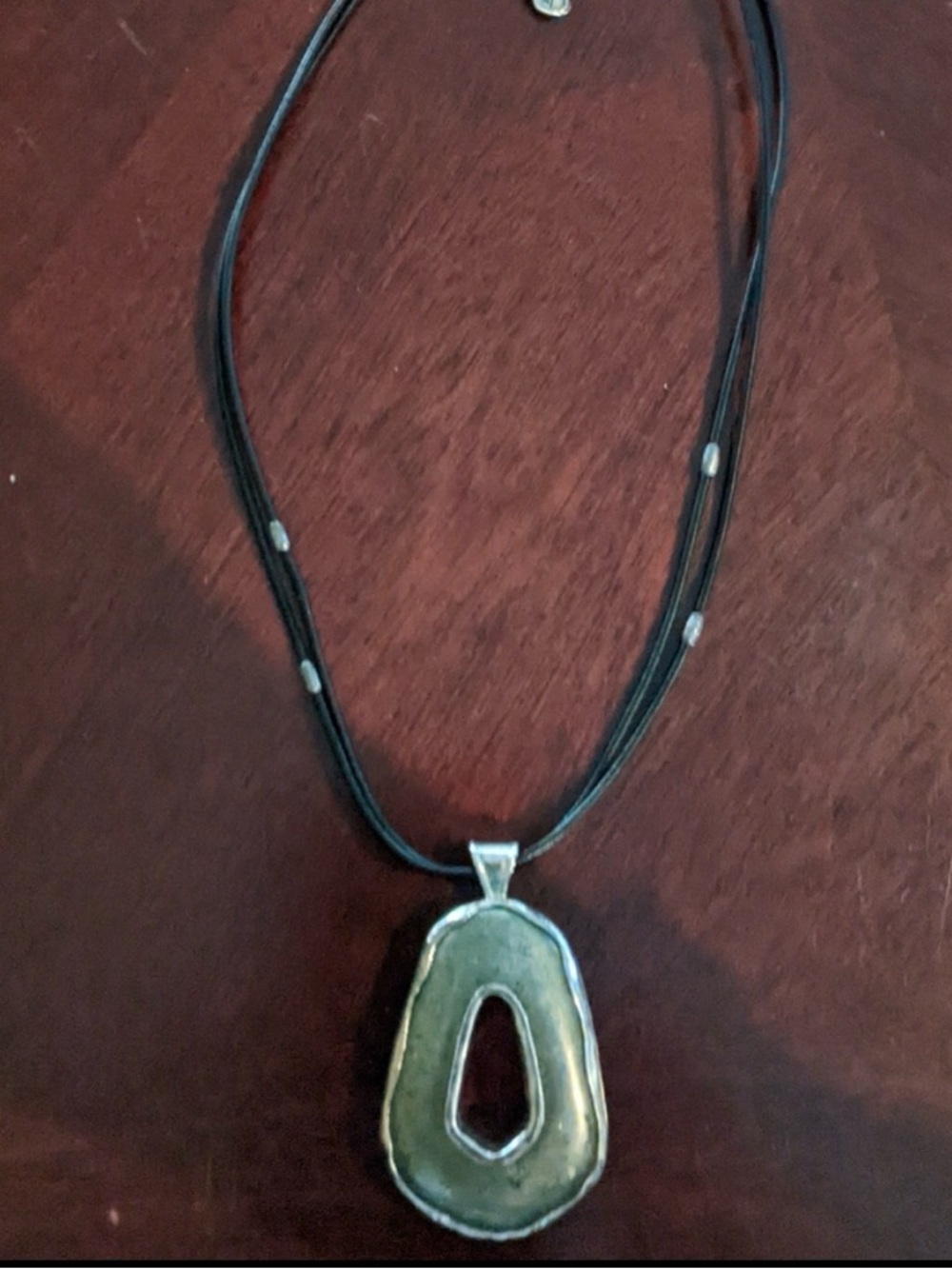 Double sided Onyx/Pyrite and sterling silver pendant on leather cord